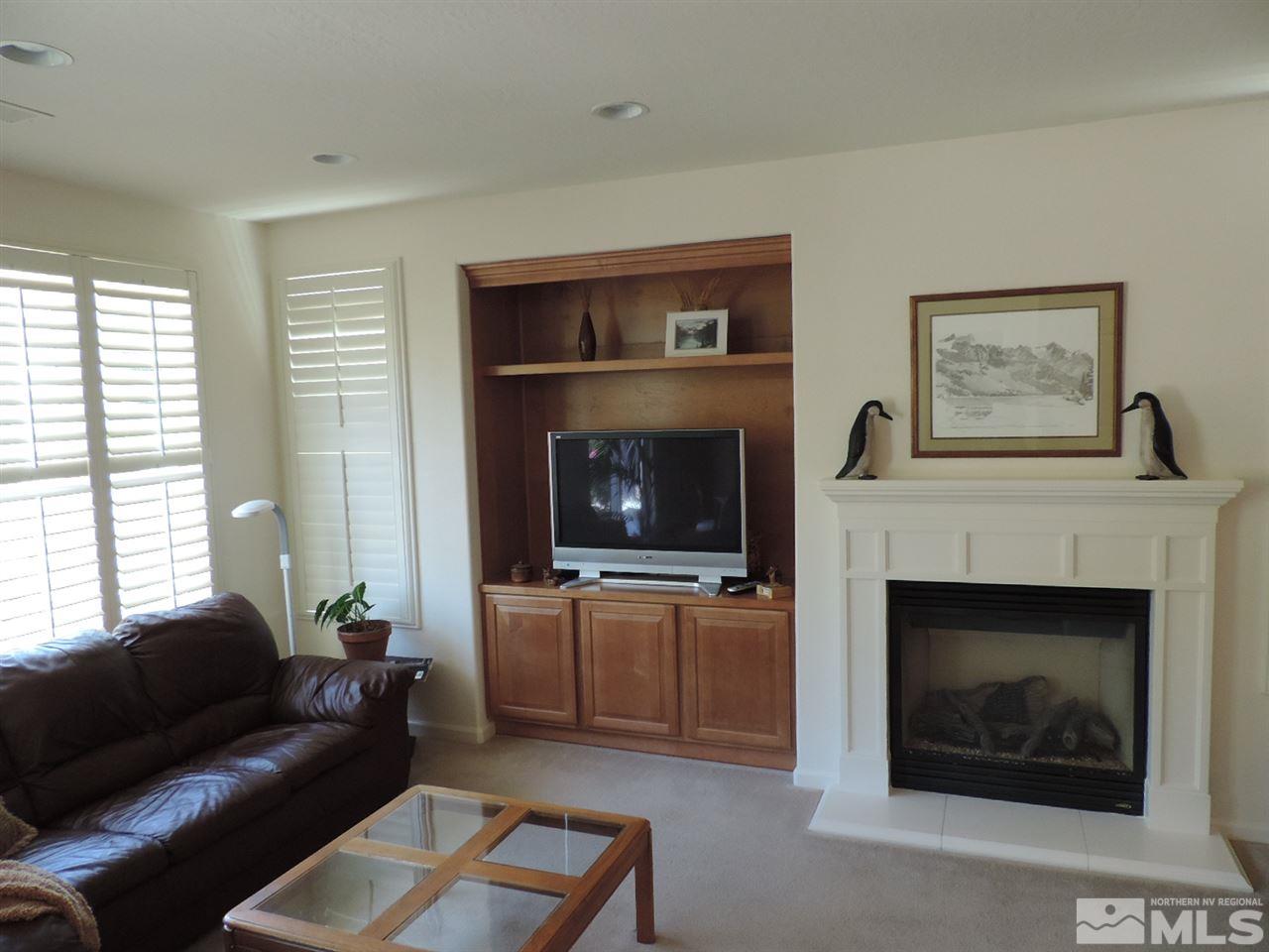 9101 Quilberry Way Reno, NV 89523 - Photo 4 of 20 a living room with furniture and a fireplace