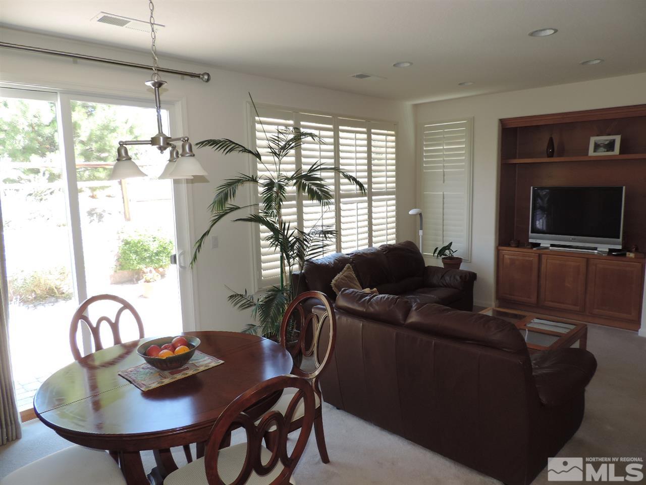 9101 Quilberry Way Reno, NV 89523 - Photo 5 of 20 a living room with furniture and a flat screen tv