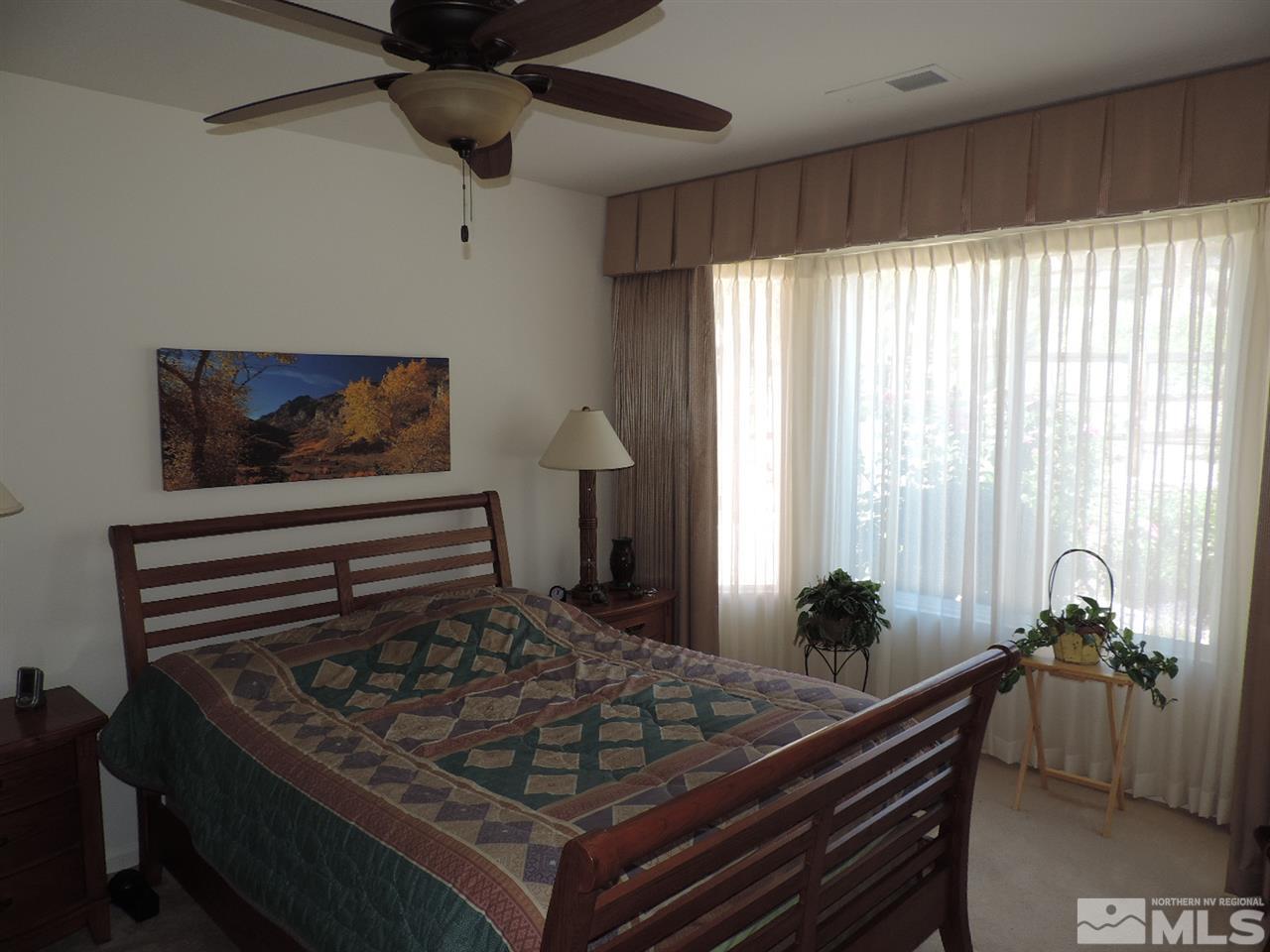 9101 Quilberry Way Reno, NV 89523 - Photo 10 of 20 a living room with furniture and a potted plant