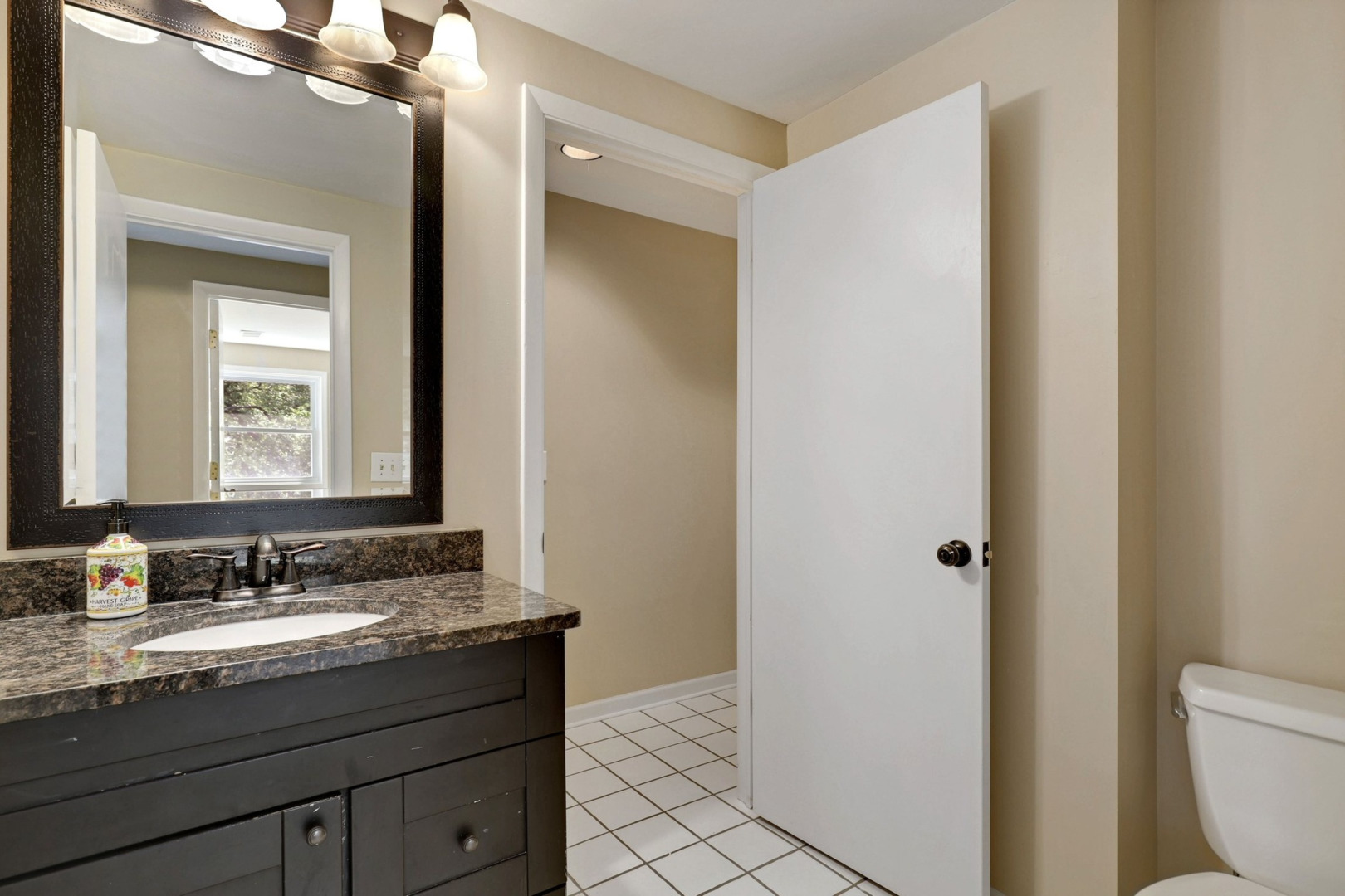 1010 South Summit Street Barrington, IL 60010 - Photo 27 of 48 a bathroom with a granite countertop sink toilet and shower