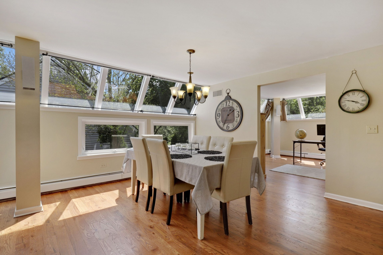 1010 South Summit Street Barrington, IL 60010 - Photo 5 of 48 a dining room with furniture a clock and wooden floor