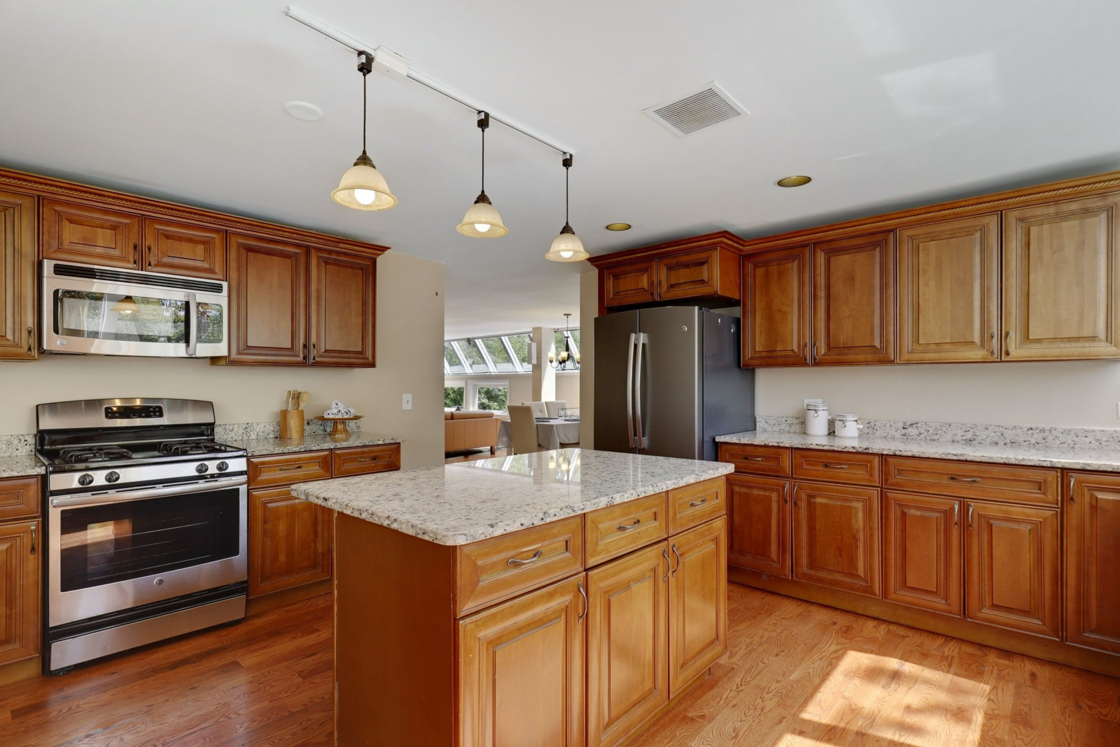 1010 South Summit Street Barrington, IL 60010 - Photo 10 of 48 a kitchen with stainless steel appliances granite countertop a sink stove and refrigerator