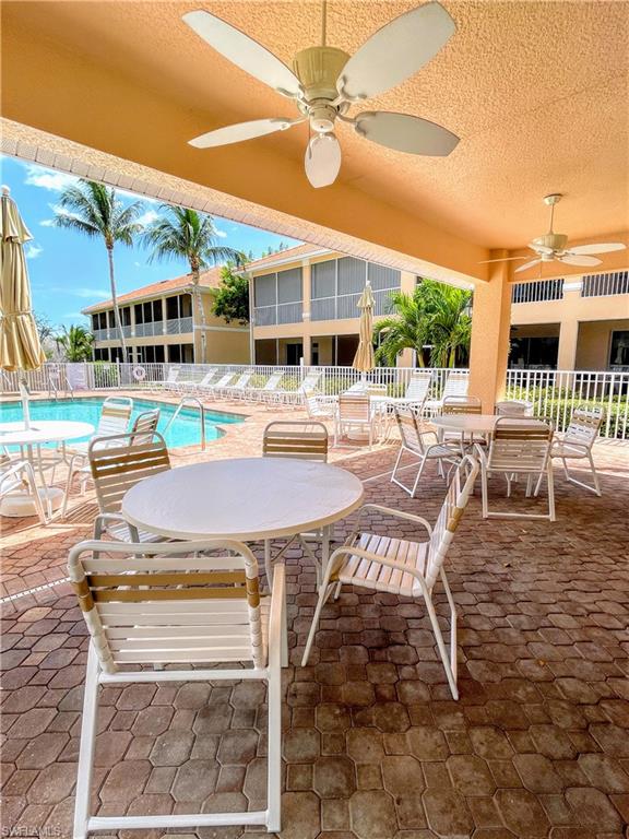 1857 San Marco Road, Unit PH3 Marco Island, FL 34145 - Photo 21 of 24 a view of a patio with dining table and chairs