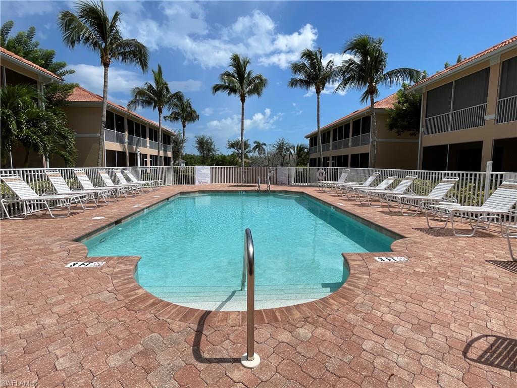 1857 San Marco Road, Unit PH3 Marco Island, FL 34145 - Photo 22 of 24 a view of a swimming pool with a lounge chair