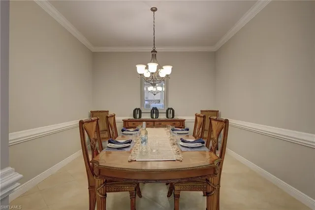 a view of a dining room with furniture and window