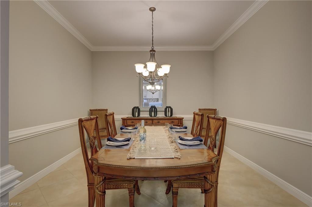 1857 San Marco Road, Unit PH3 Marco Island, FL 34145 - Photo 7 of 24 a view of a dining room with furniture and window