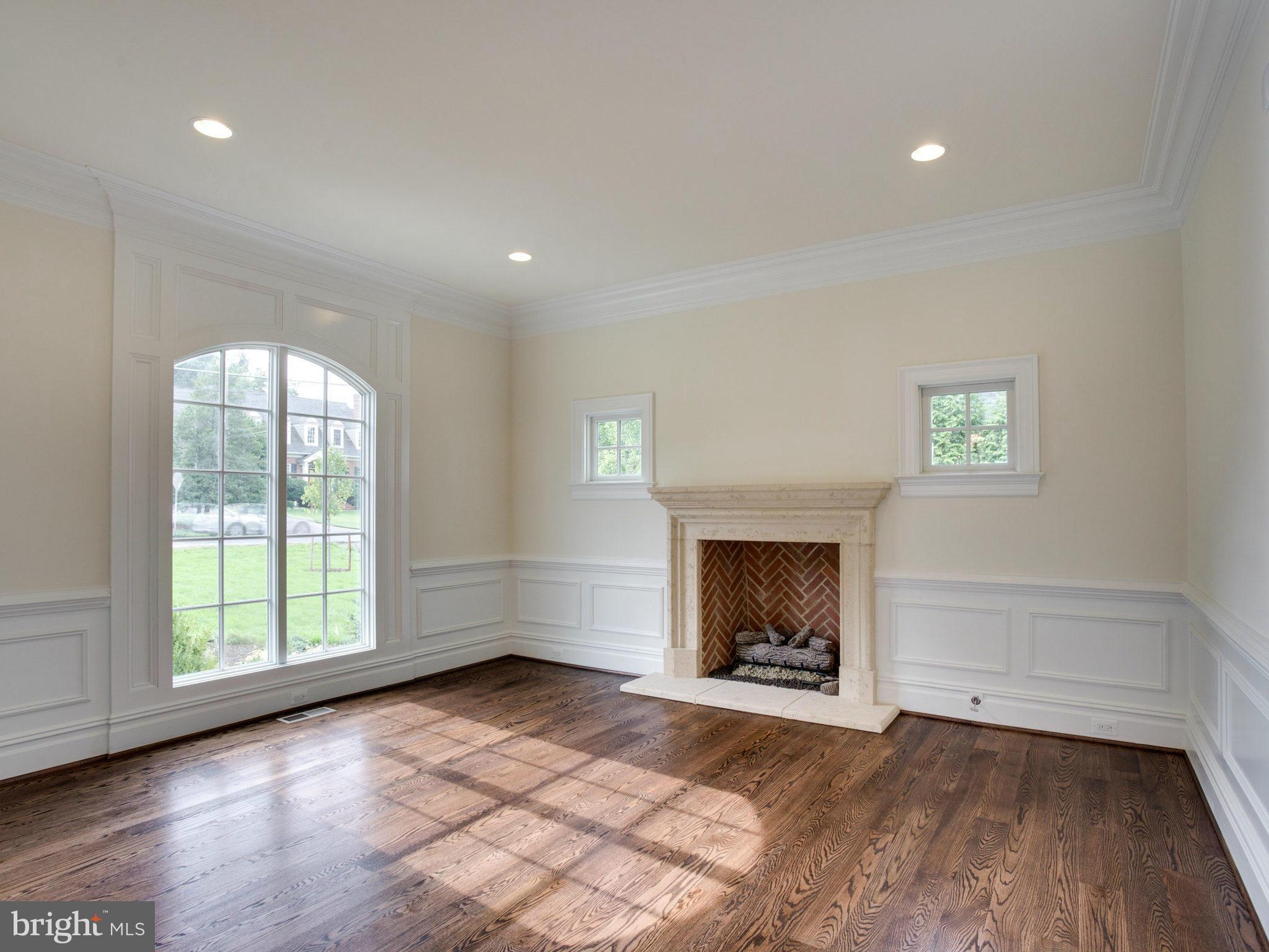 926 Douglass Drive McLean, VA 22101 - Photo 2 of 29 an empty room with windows and fireplace