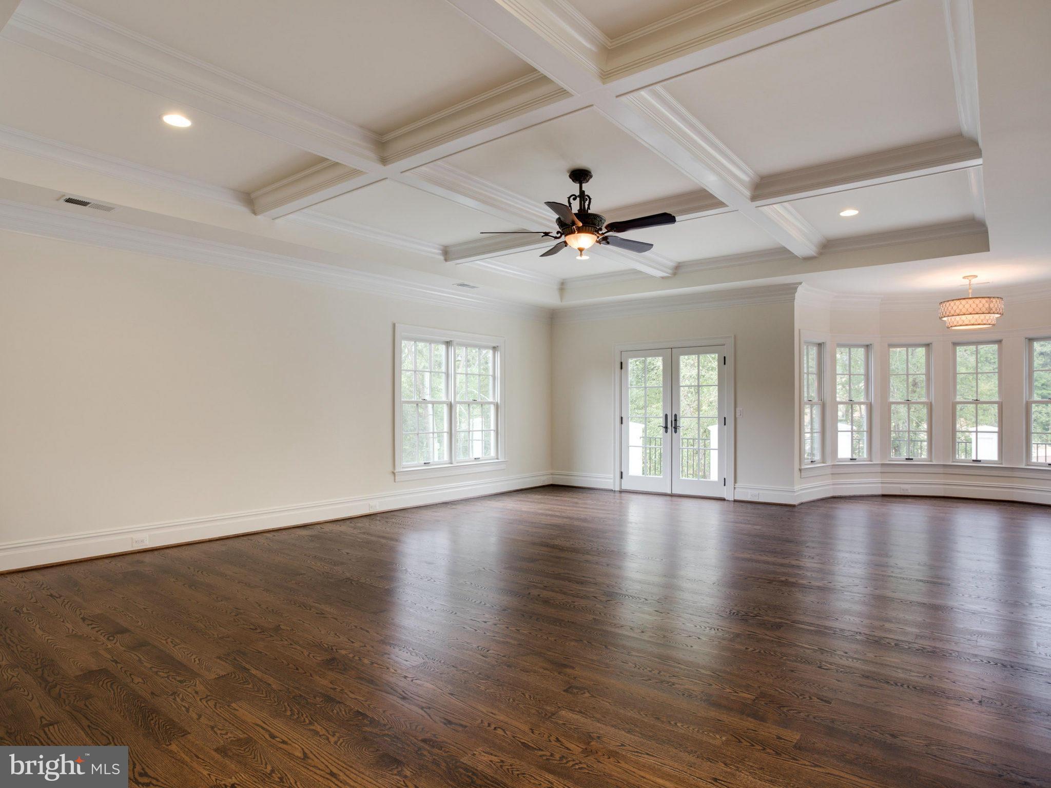 926 Douglass Drive McLean, VA 22101 - Photo 15 of 29 a view of an empty room with wooden floor and a window