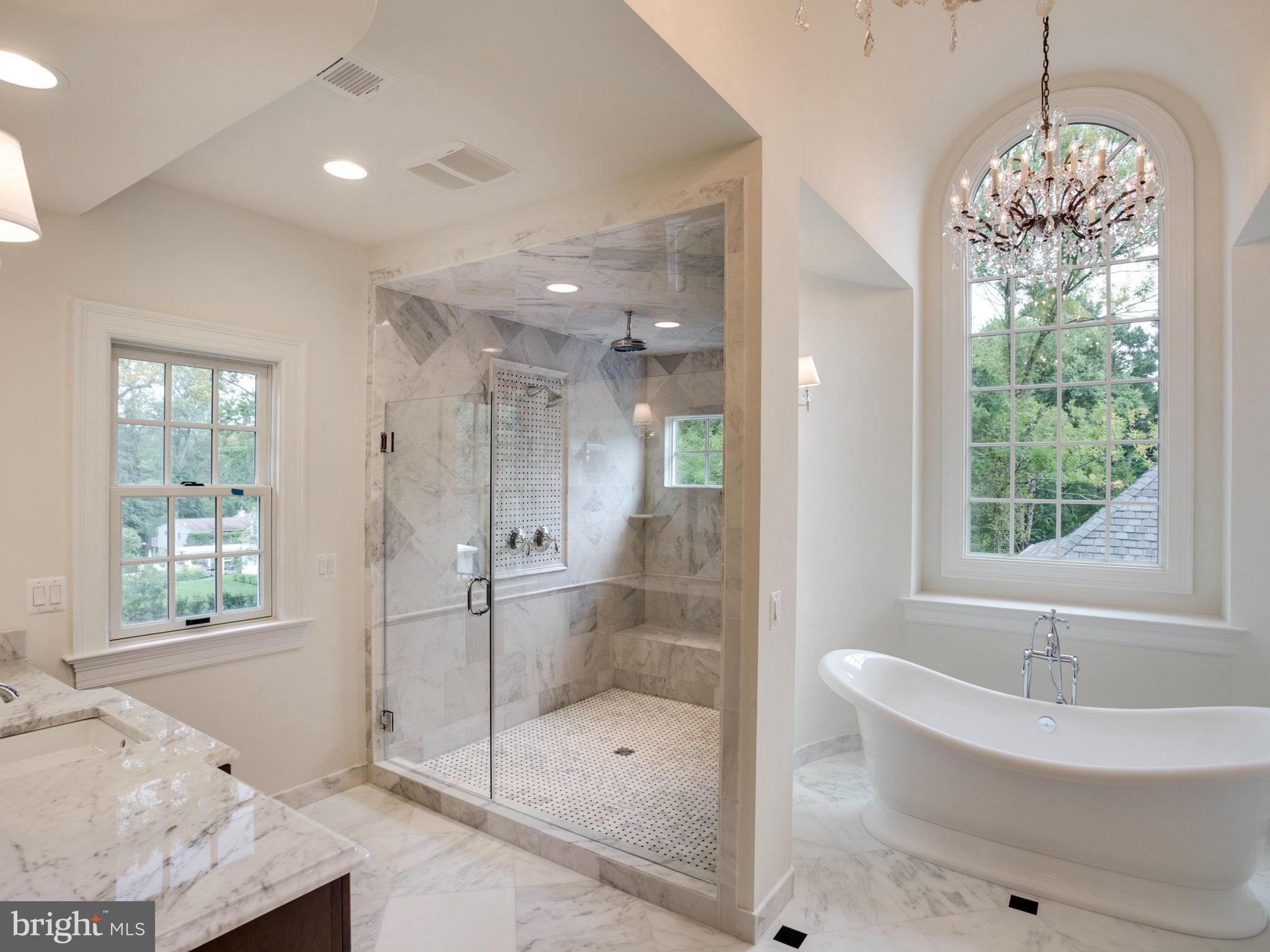 926 Douglass Drive McLean, VA 22101 - Photo 17 of 29 a bathroom with a tub shower and window