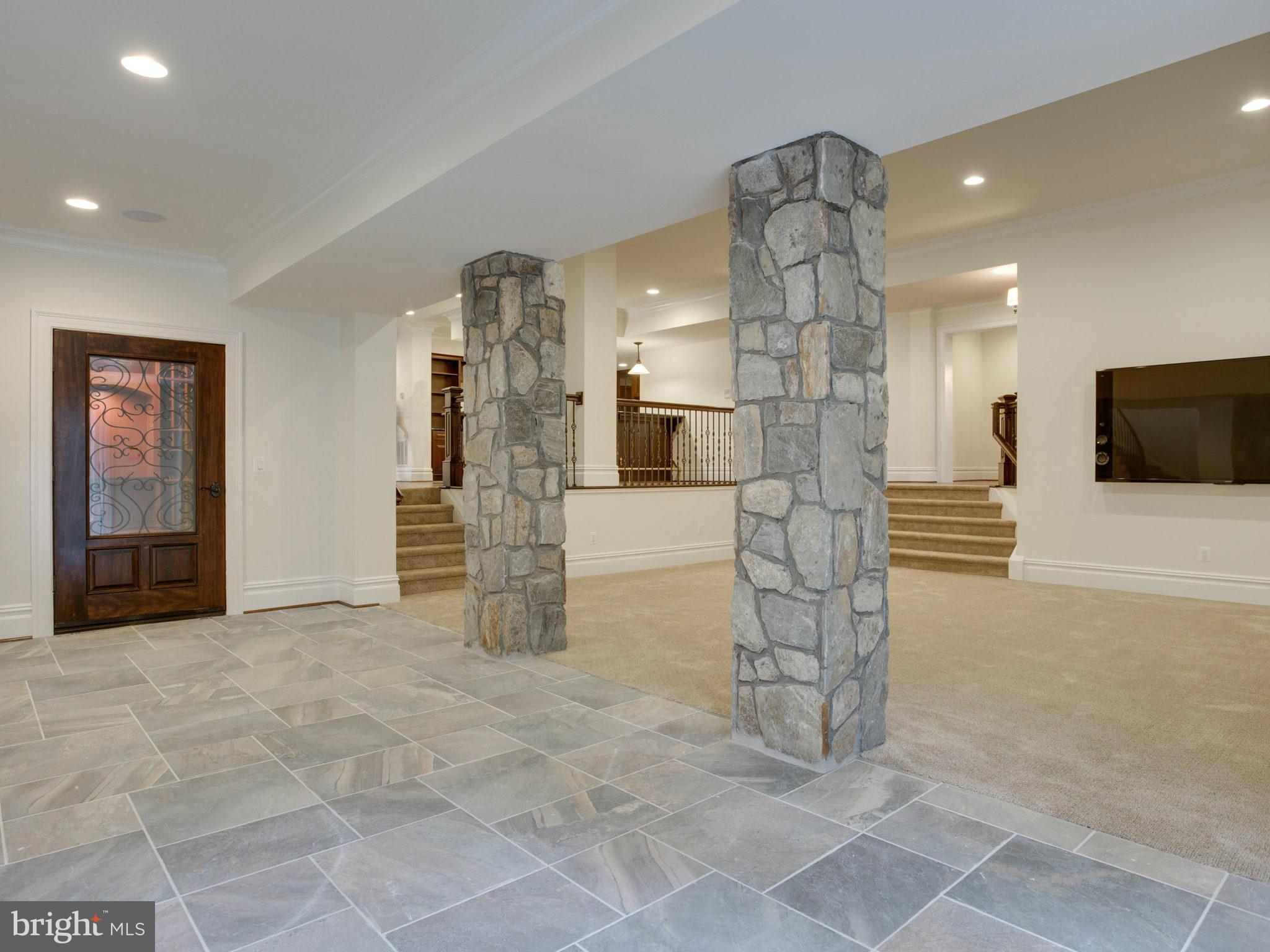 926 Douglass Drive McLean, VA 22101 - Photo 22 of 29 a view of a hallway with stairs and a couch