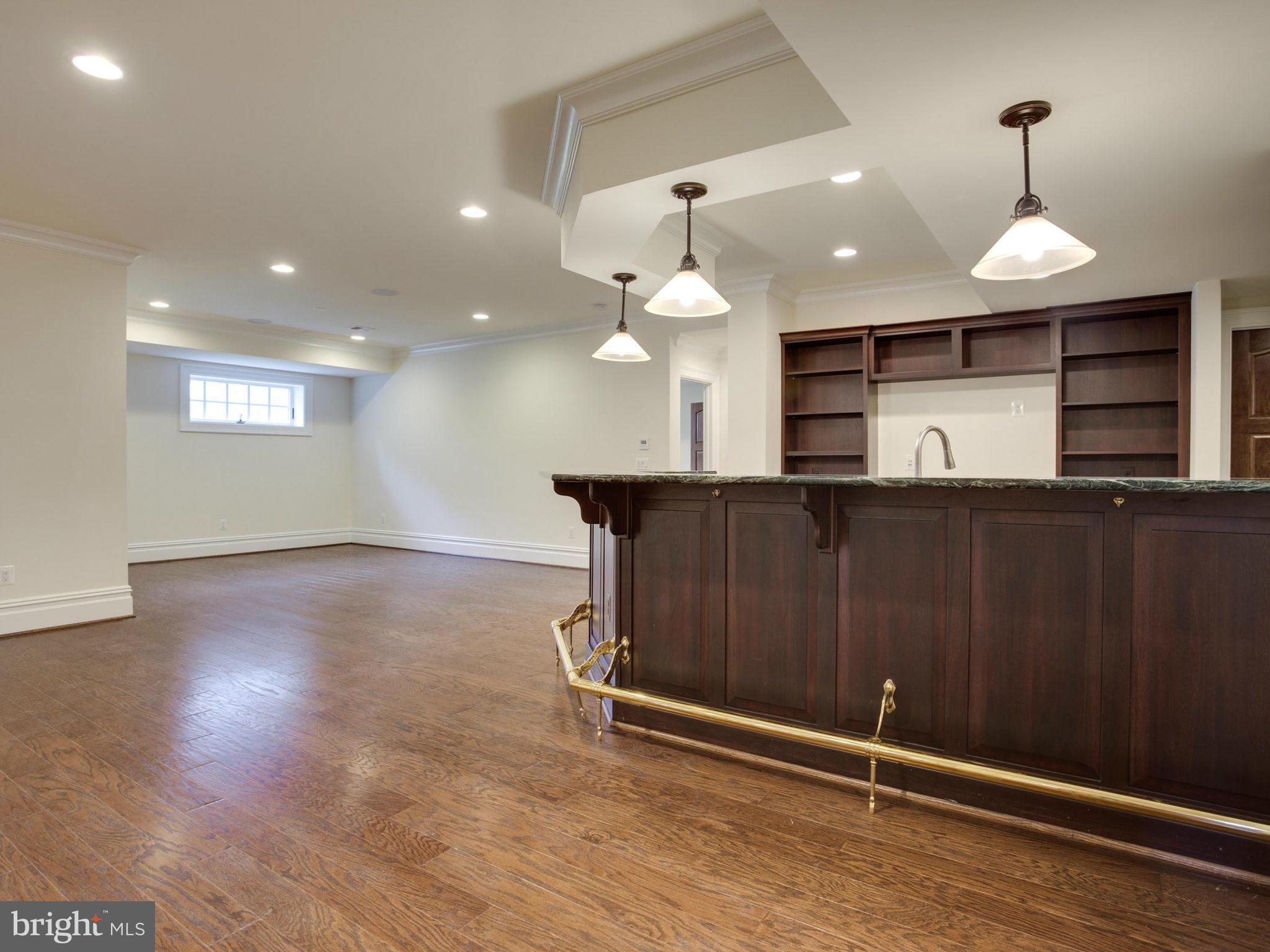926 Douglass Drive McLean, VA 22101 - Photo 27 of 29 a view of kitchen and kitchen with granite countertop wooden floor