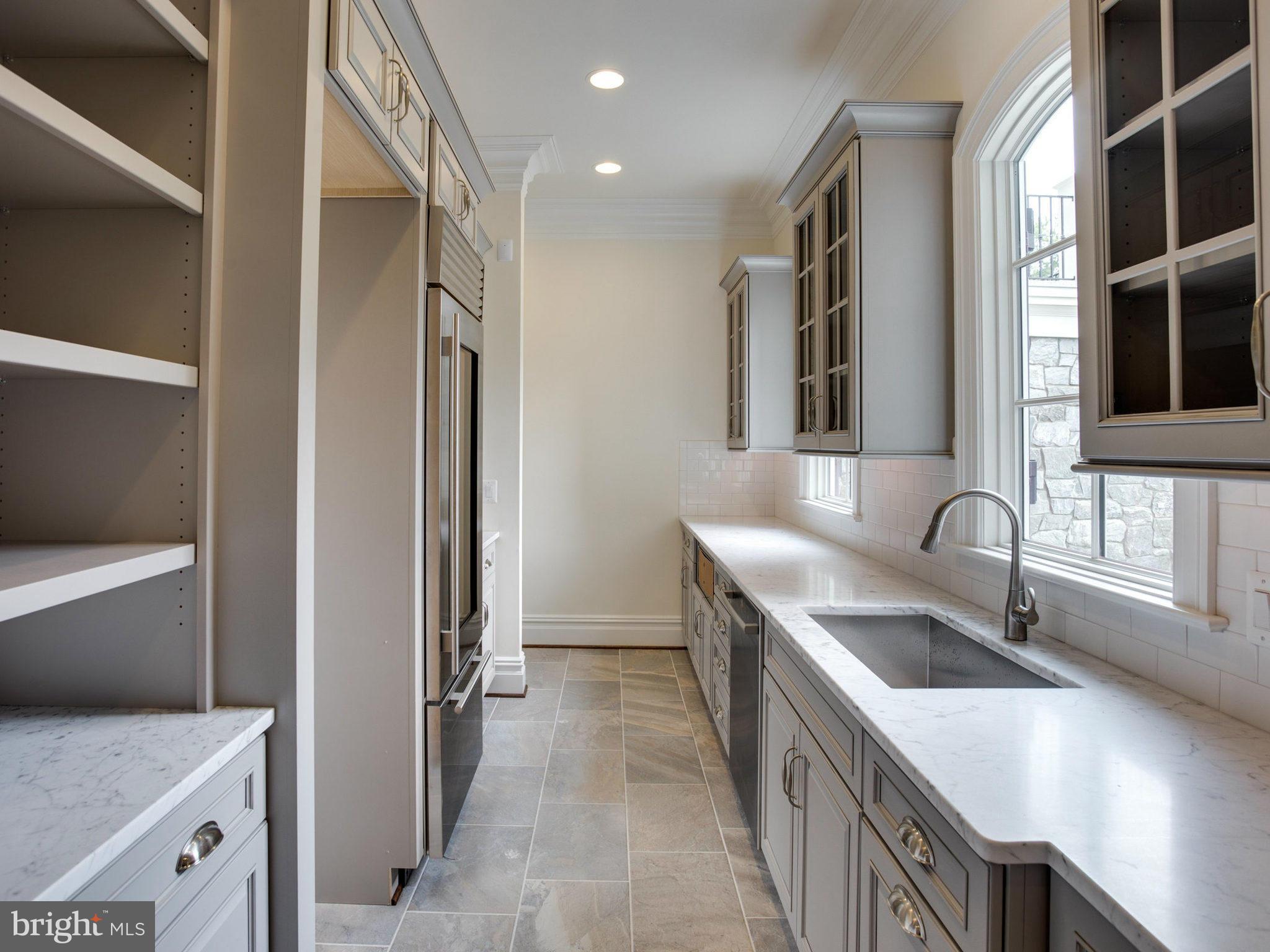926 Douglass Drive McLean, VA 22101 - Photo 8 of 29 a kitchen with a sink a stove and a refrigerator