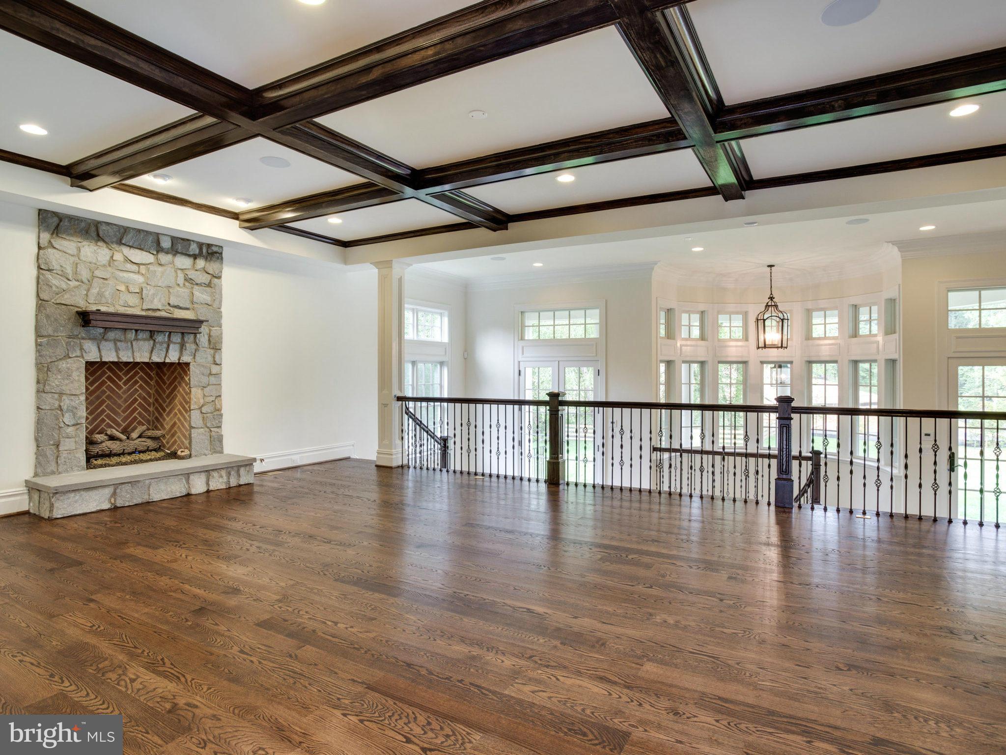 926 Douglass Drive McLean, VA 22101 - Photo 10 of 29 a view of an empty room with wooden floor and a fireplace
