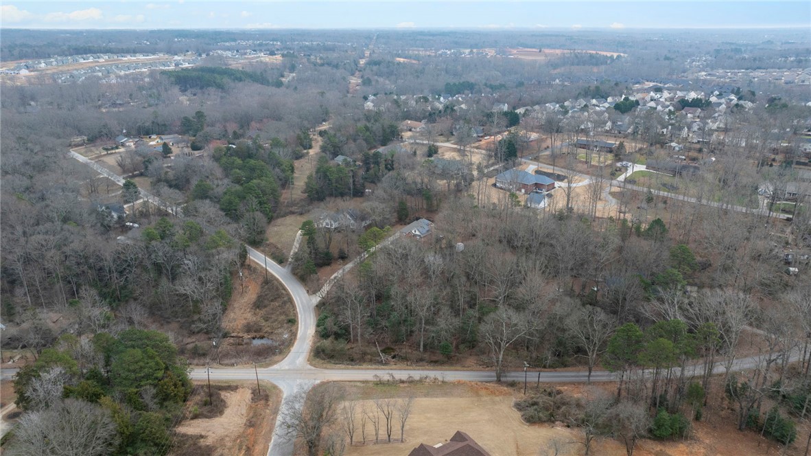 0 Standing Springs Road Greenville, SC 29605 - Photo 9 of 25 Expansive landscape featuring wooded areas and winding roads, offering a sense of seclusion and natural beauty.