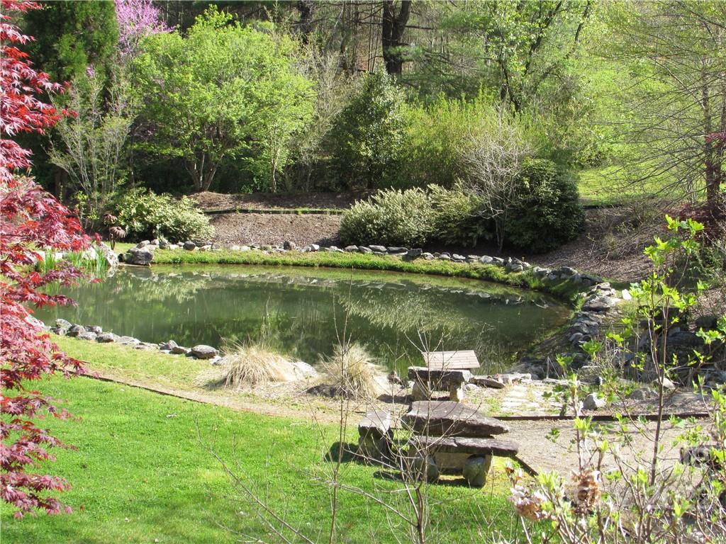 E-18-17 E-18-17 Red Wolf Run, Unit NONE Mars Hill, NC 28754 - Photo 4 of 24 a view of a lake with houses in outdoor space