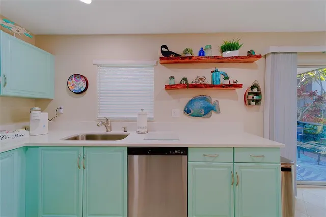 a dining room with furniture and a floor to ceiling window