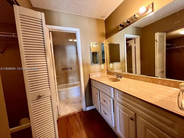 a bathroom with a toilet and a sink