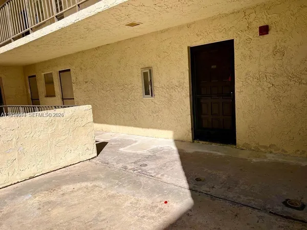 a view of a back yard of the building