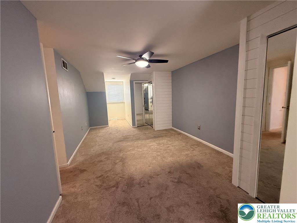 170 Springhouse Road Allentown, PA 18104 - Photo 17 of 23 A well-proportioned room featuring sloped ceilings and ample floor space.