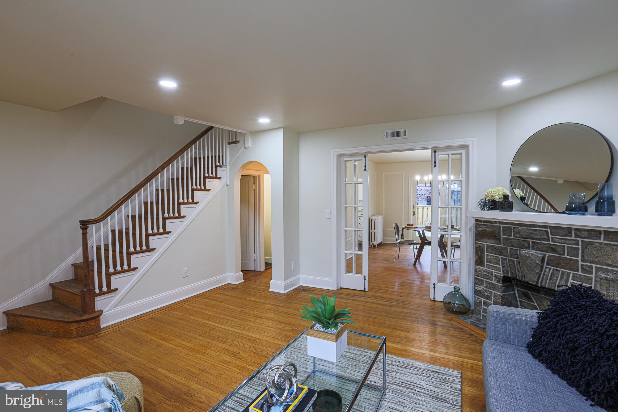 3716 Rexmere Road Baltimore, MD 21218 - Photo 14 of 54 a view of livingroom with dining room and hall with wooden floor