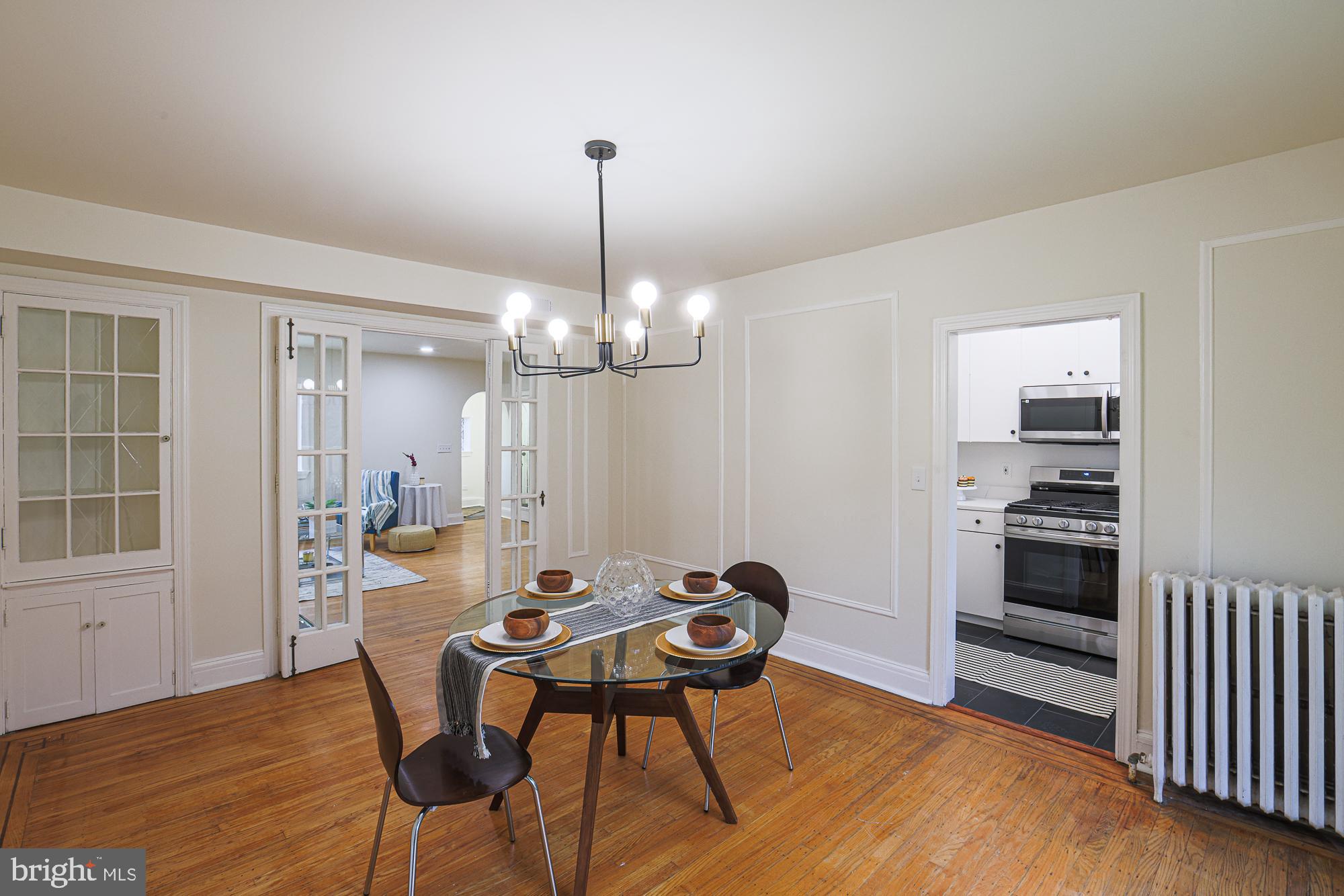 3716 Rexmere Road Baltimore, MD 21218 - Photo 20 of 54 a view of a dining room with furniture window and wooden floor