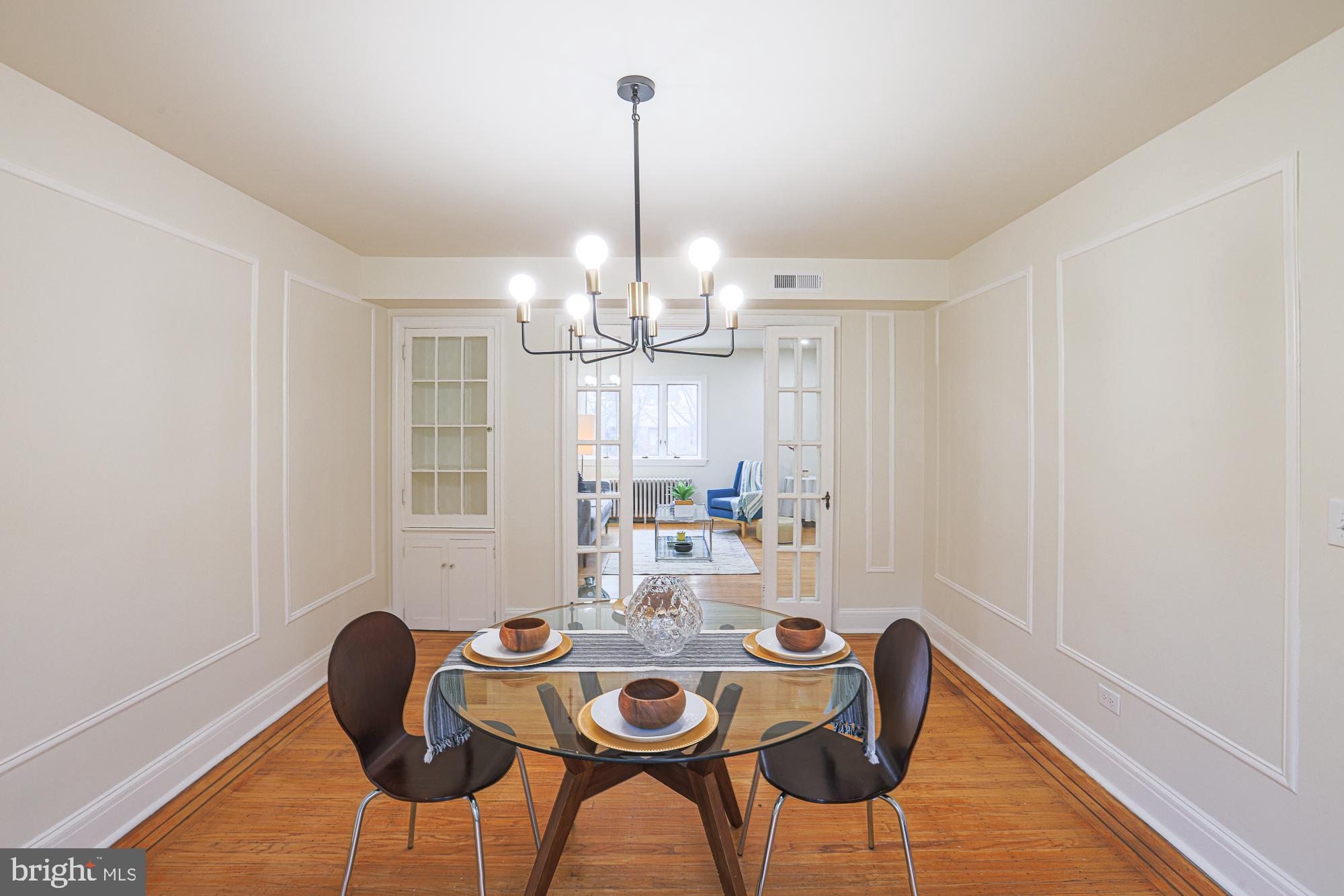 3716 Rexmere Road Baltimore, MD 21218 - Photo 21 of 54 a view of a dining room with furniture and chandelier