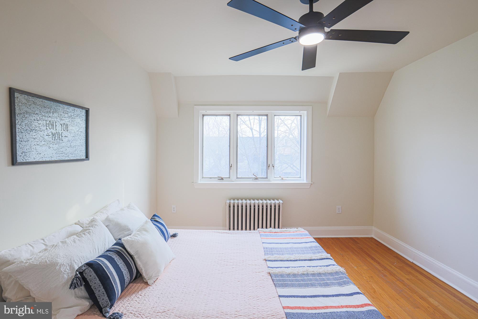 3716 Rexmere Road Baltimore, MD 21218 - Photo 29 of 54 a bedroom with a bed and a window