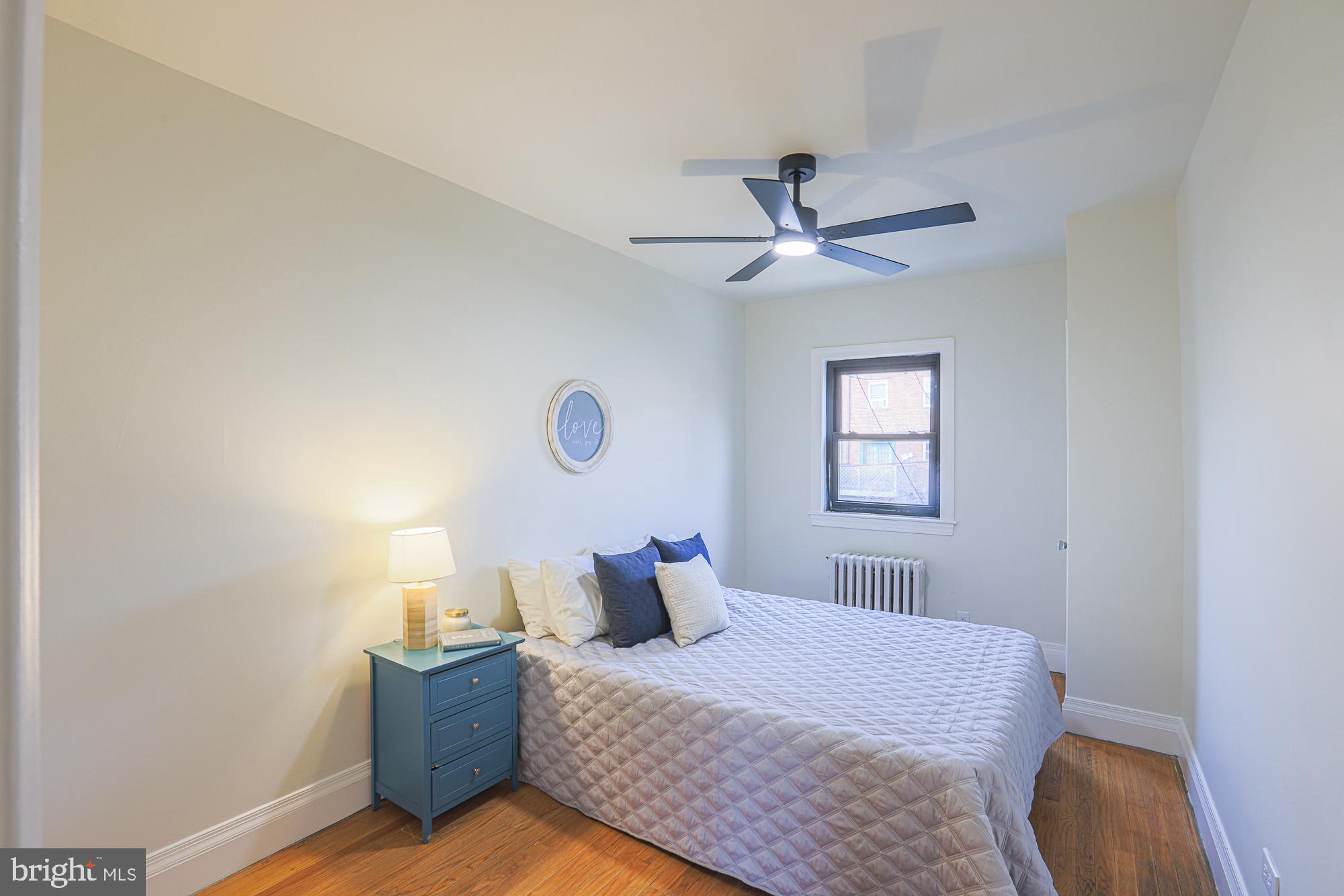 3716 Rexmere Road Baltimore, MD 21218 - Photo 32 of 54 a bedroom with a bed and window