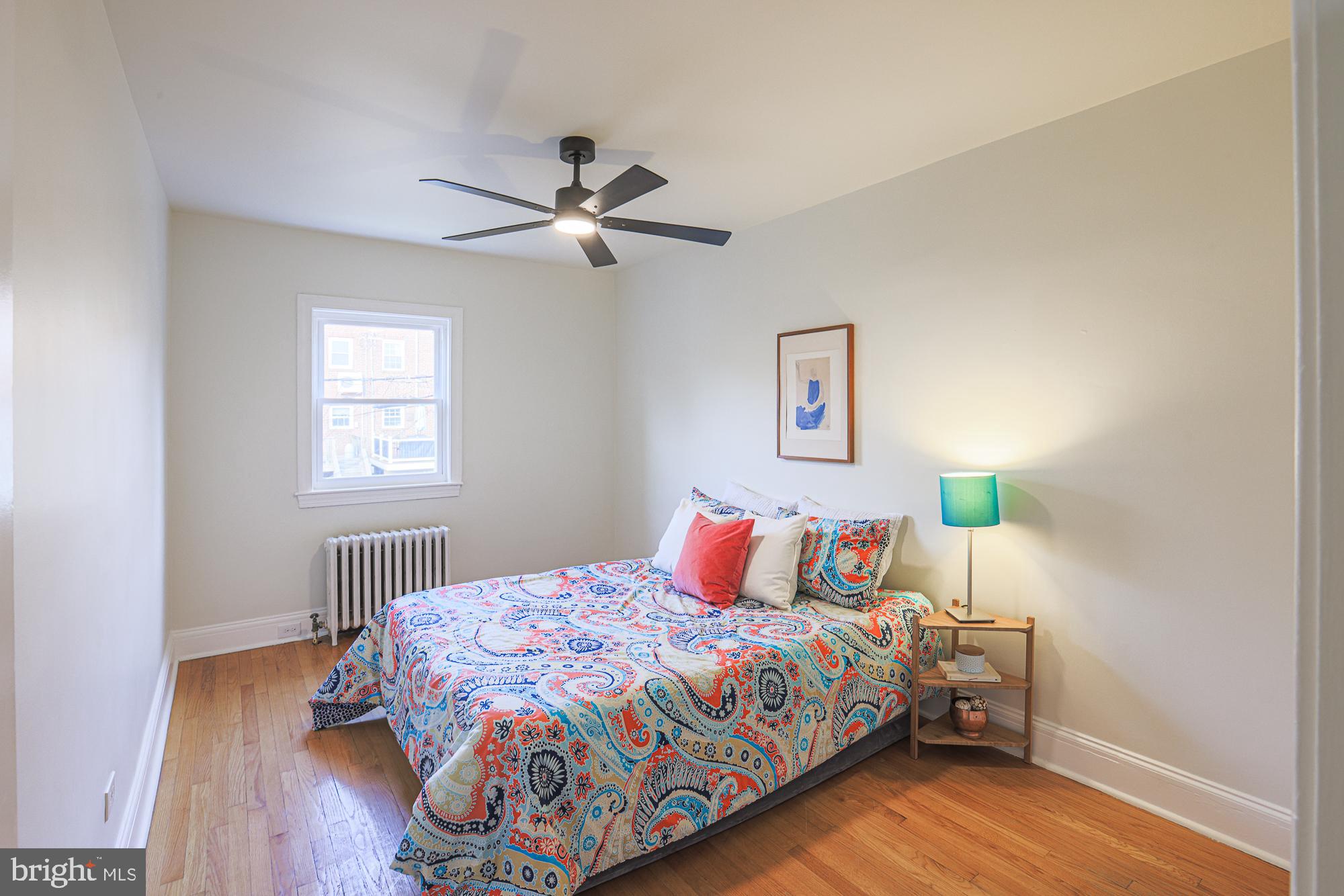 3716 Rexmere Road Baltimore, MD 21218 - Photo 34 of 54 a bedroom with a bed and wooden floor