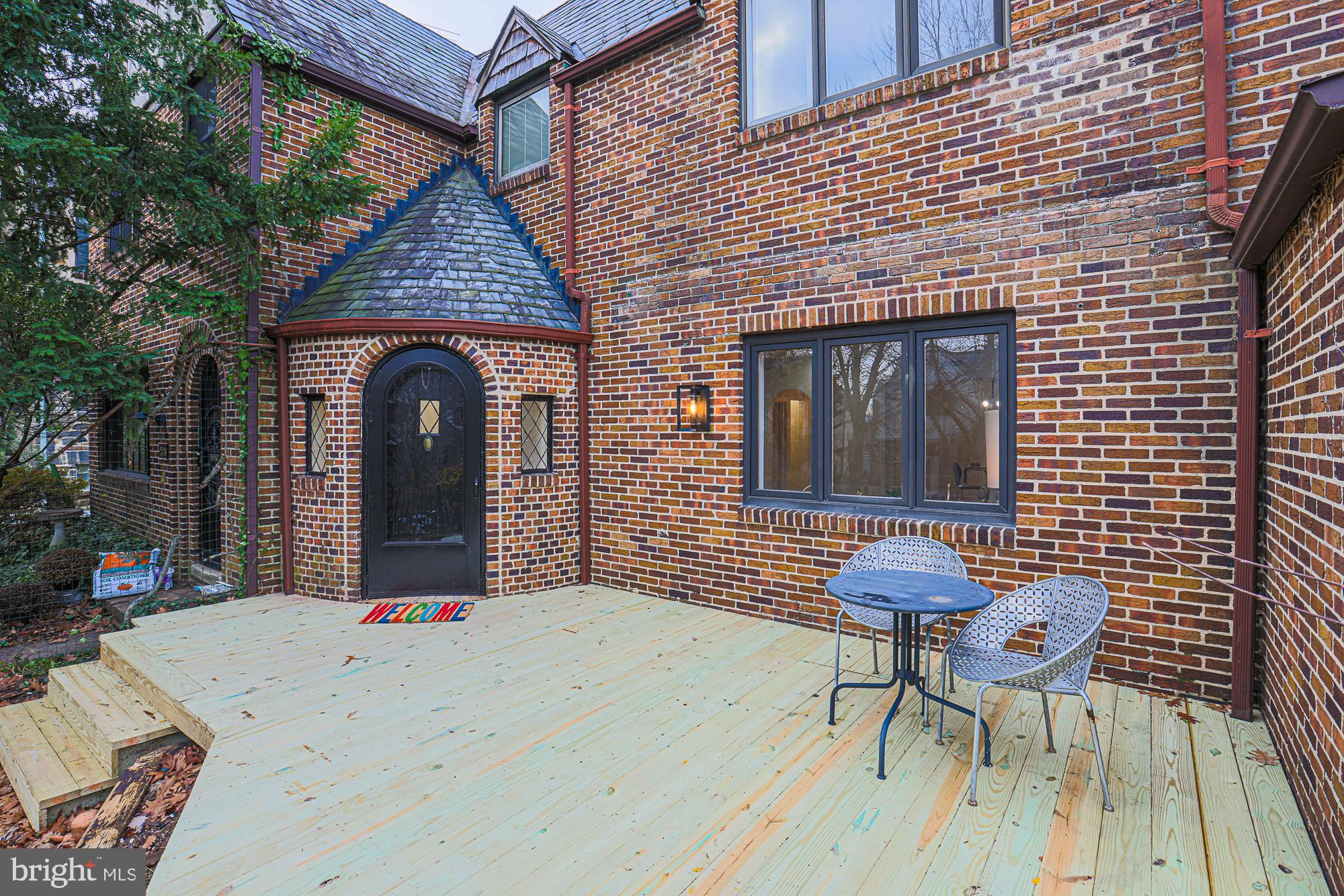 3716 Rexmere Road Baltimore, MD 21218 - Photo 4 of 54 a front view of a house with outdoor seating