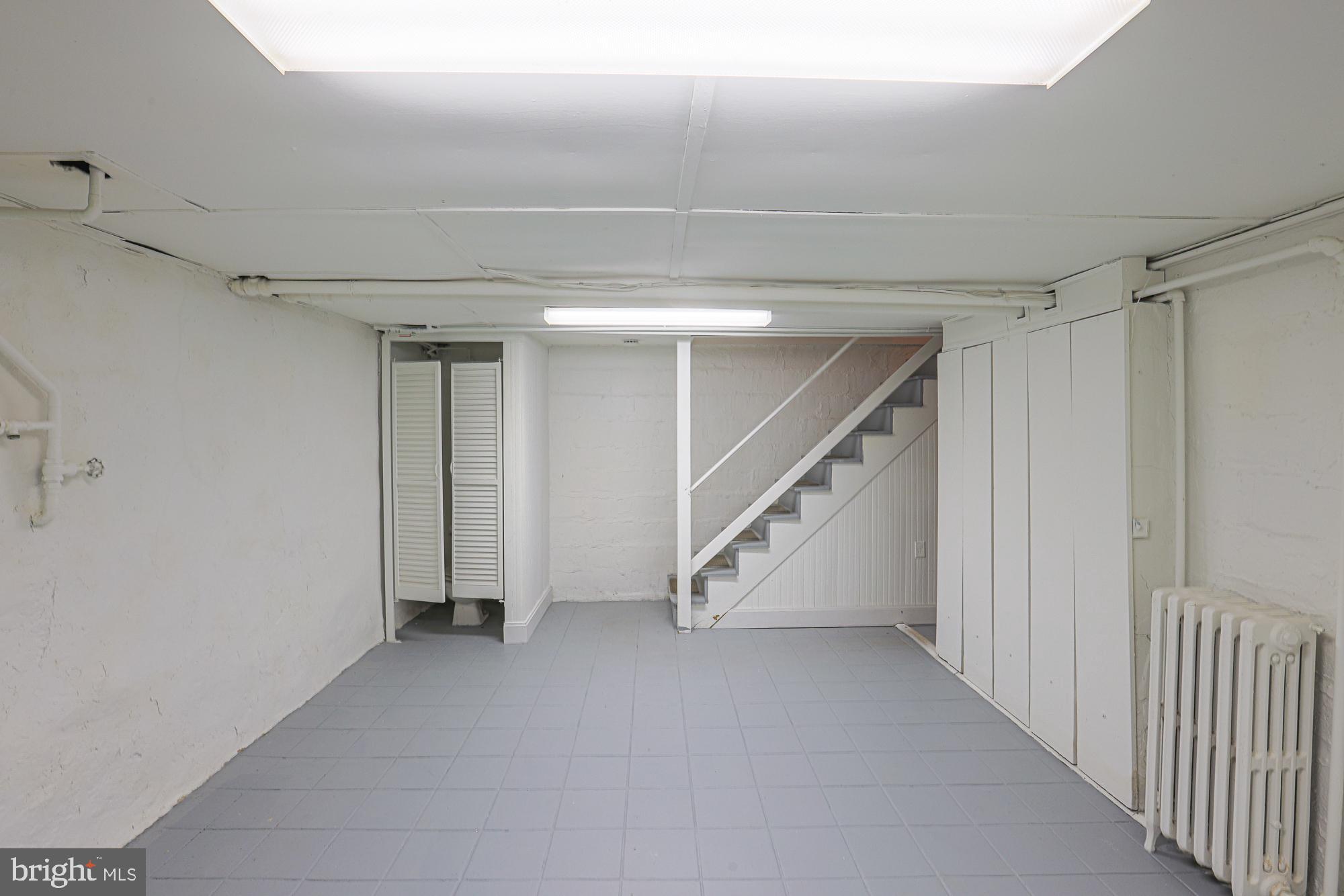 3716 Rexmere Road Baltimore, MD 21218 - Photo 42 of 54 a view of an empty room with stairs