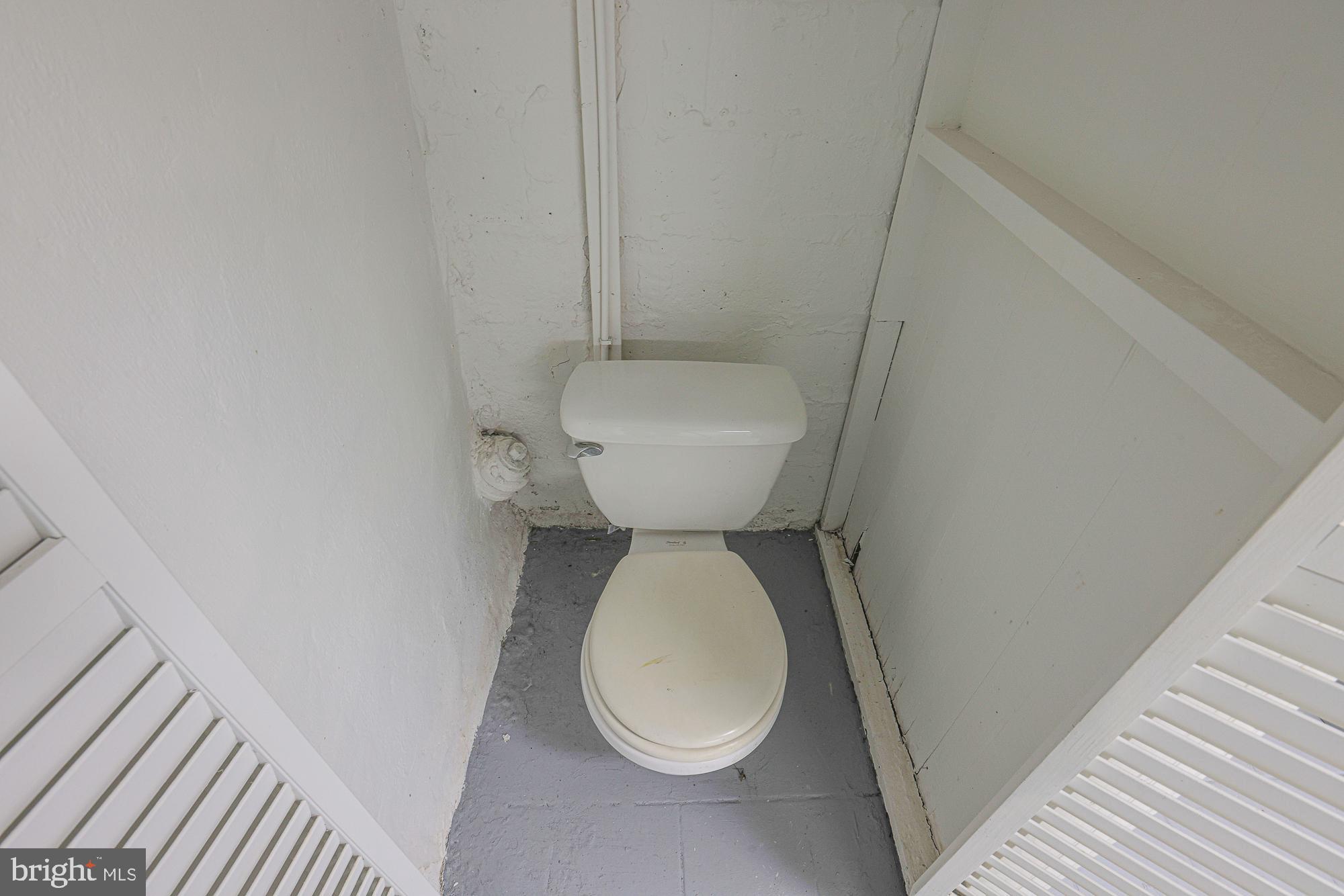 3716 Rexmere Road Baltimore, MD 21218 - Photo 44 of 54 a bathroom with a toilet and a sink