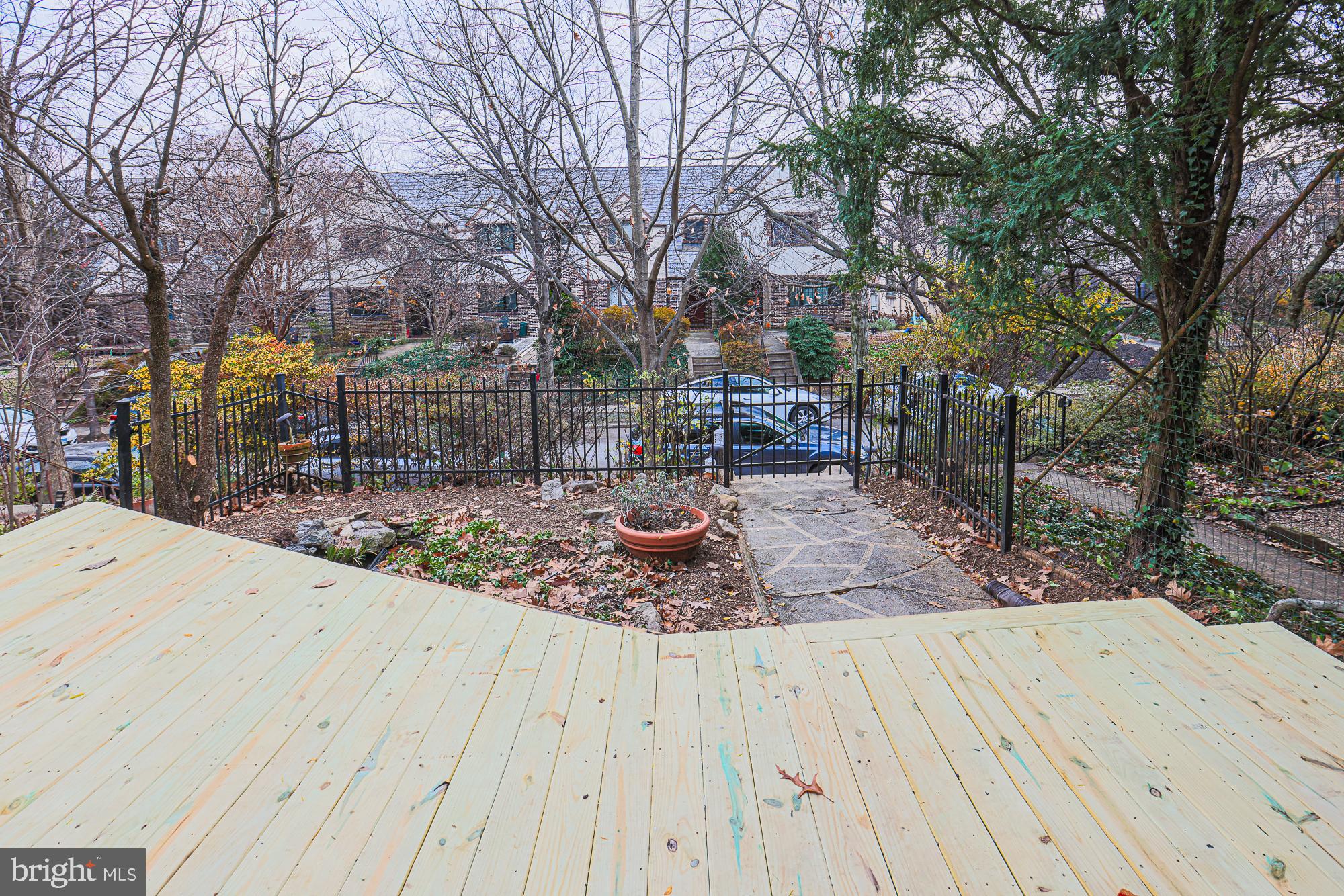 3716 Rexmere Road Baltimore, MD 21218 - Photo 6 of 54 a view of a backyard with wooden fence