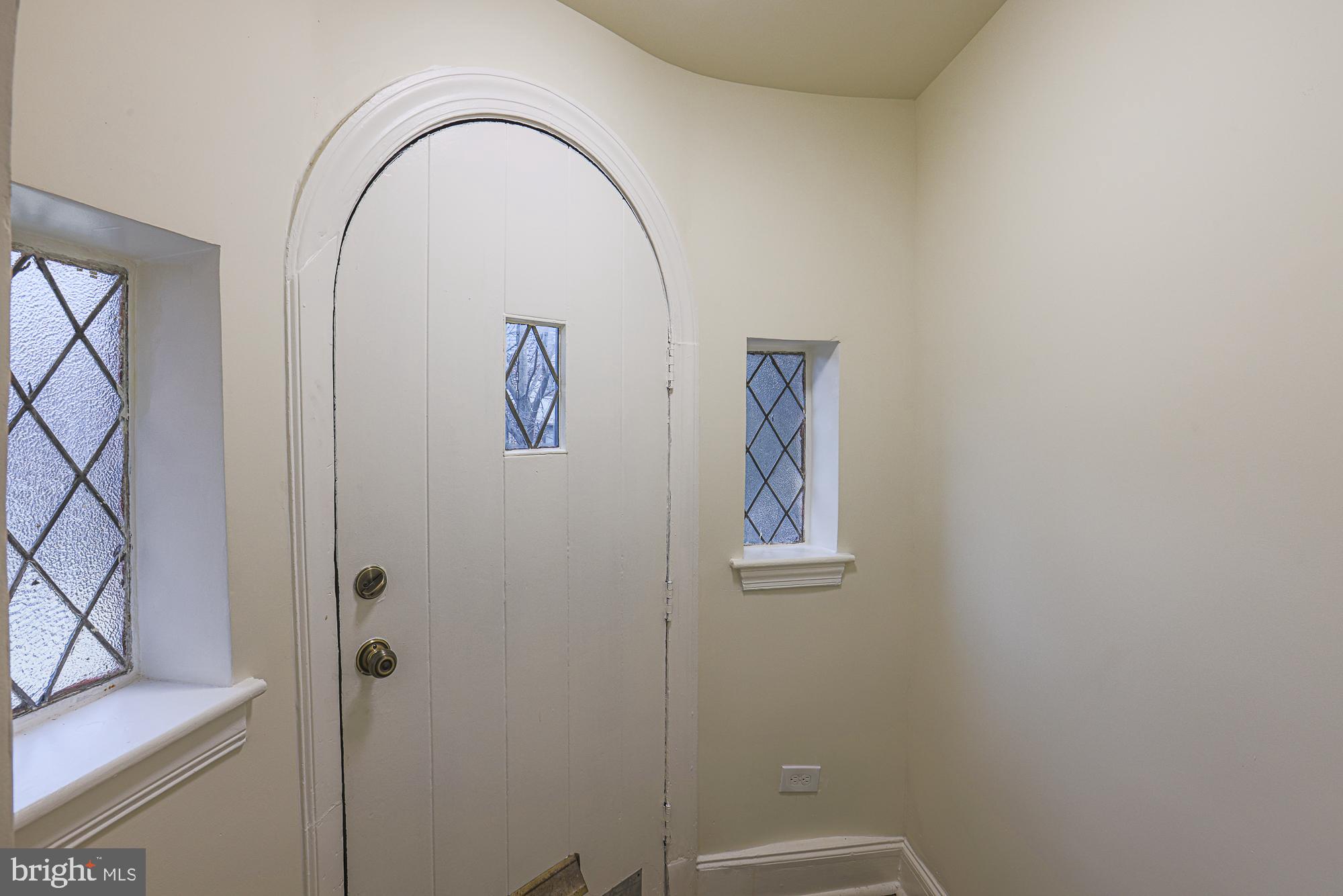 3716 Rexmere Road Baltimore, MD 21218 - Photo 8 of 54 an empty room with a door