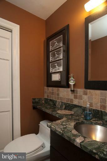 4822 Hampden Lane, Unit R Bethesda, MD 20814 - Photo 2 of 22 Renovated 1/2 Bath w/storage closet