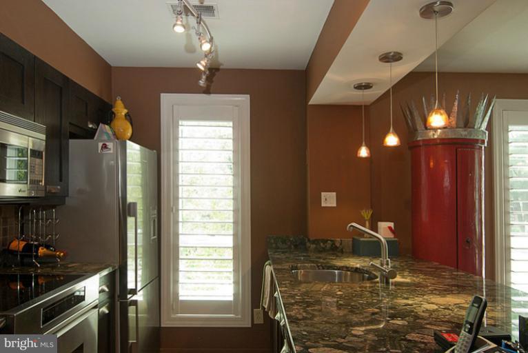 4822 Hampden Lane, Unit R Bethesda, MD 20814 - Photo 14 of 22 Renovated Kitchen with pendant lighting & more!