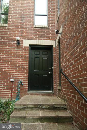 4822 Hampden Lane, Unit R Bethesda, MD 20814 - Photo 7 of 22 Front entry beyond wrought iron gate