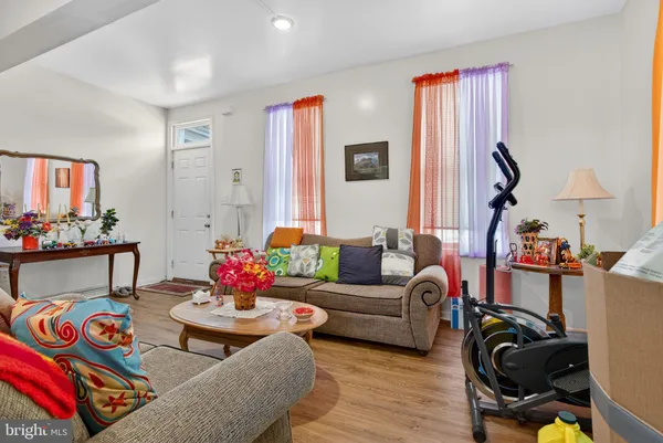 a living room with furniture or couch and a flat screen tv