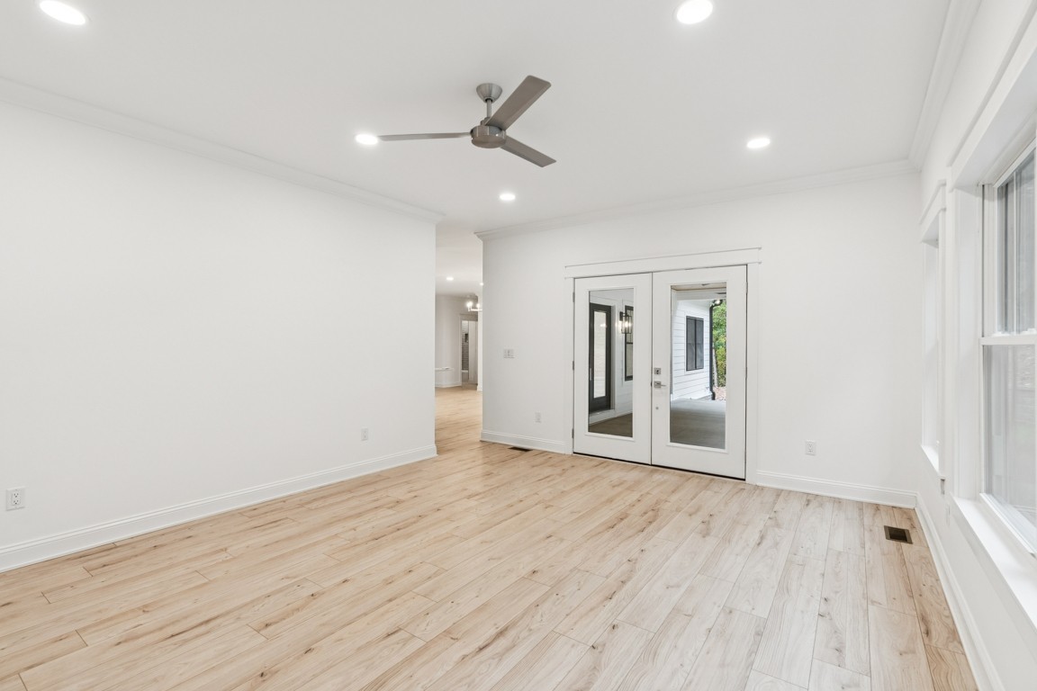 6461 Highway 48 North Cumberland Furnace, TN 37051 - Photo 14 of 25 an empty room with wooden floor and windows