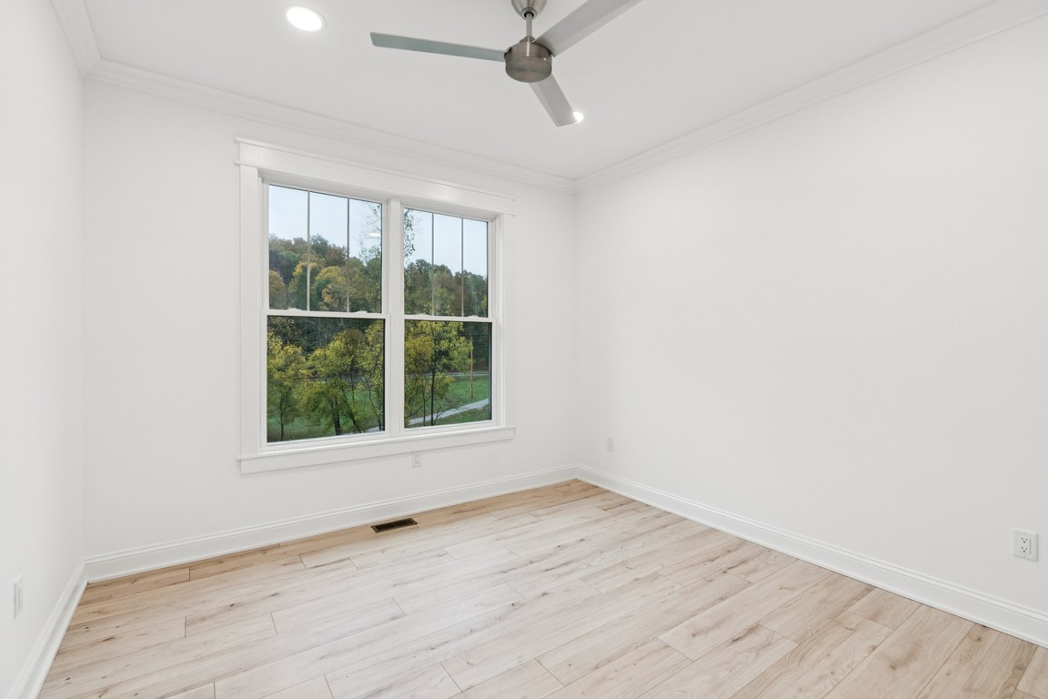 6461 Highway 48 North Cumberland Furnace, TN 37051 - Photo 21 of 25 an empty room with wooden floor and windows