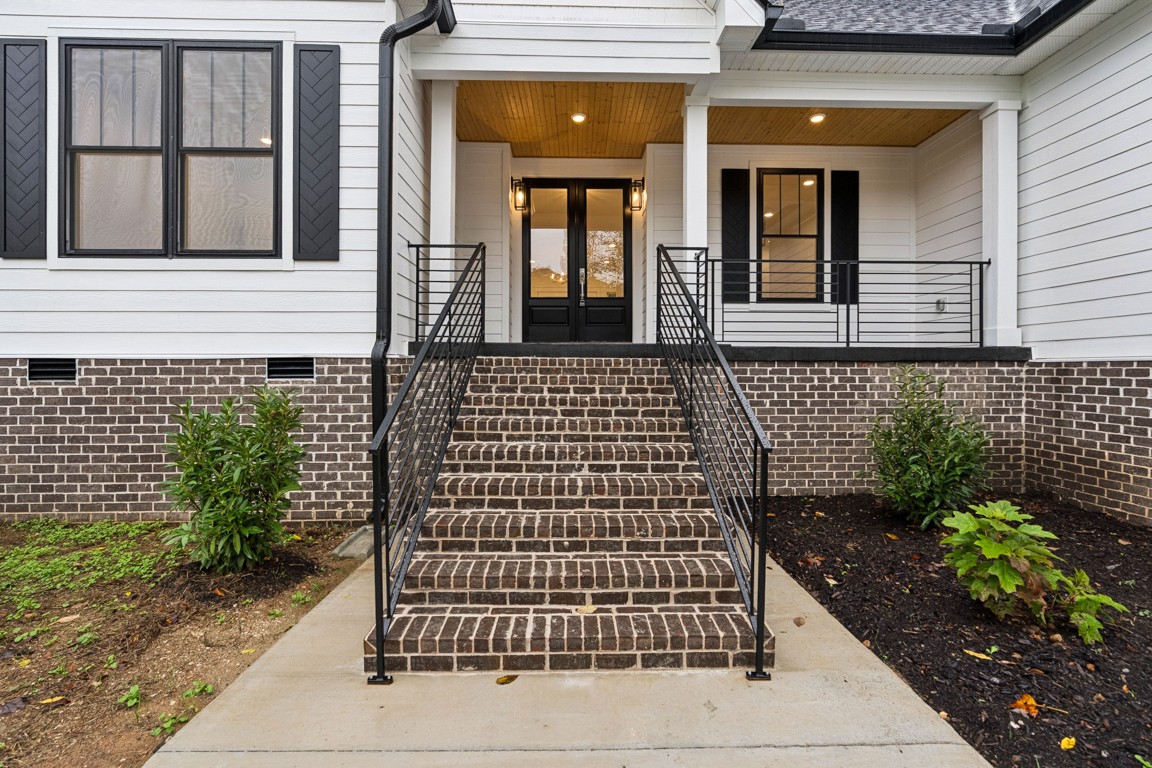 6461 Highway 48 North Cumberland Furnace, TN 37051 - Photo 4 of 25 a view of a brick house with potted plants