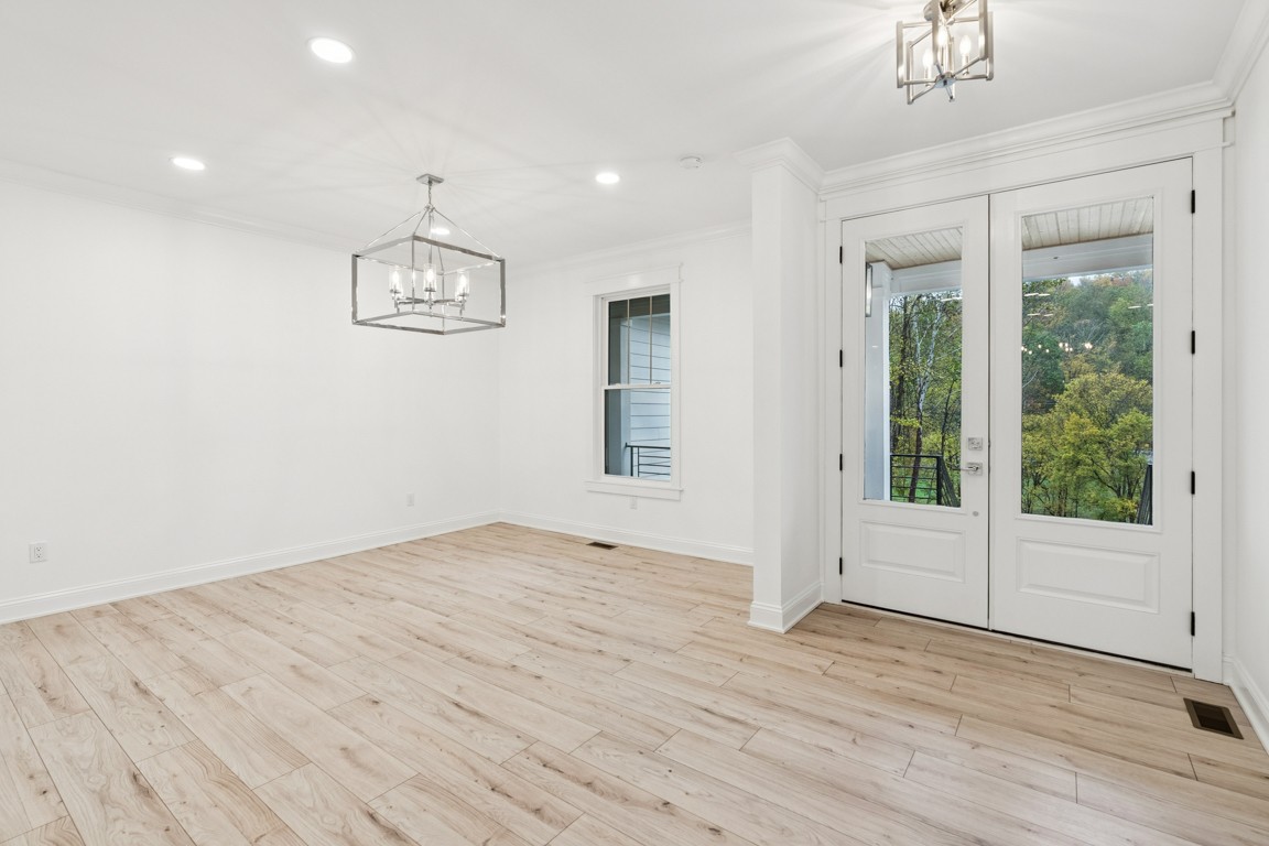 6461 Highway 48 North Cumberland Furnace, TN 37051 - Photo 5 of 25 an empty room with wooden floor and windows