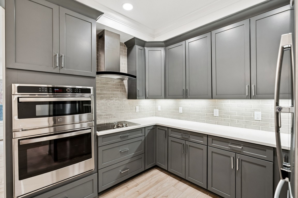 6461 Highway 48 North Cumberland Furnace, TN 37051 - Photo 10 of 25 a kitchen with stainless steel appliances wooden cabinets and a stove top oven