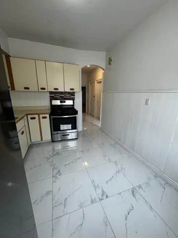a kitchen with sink and cabinets