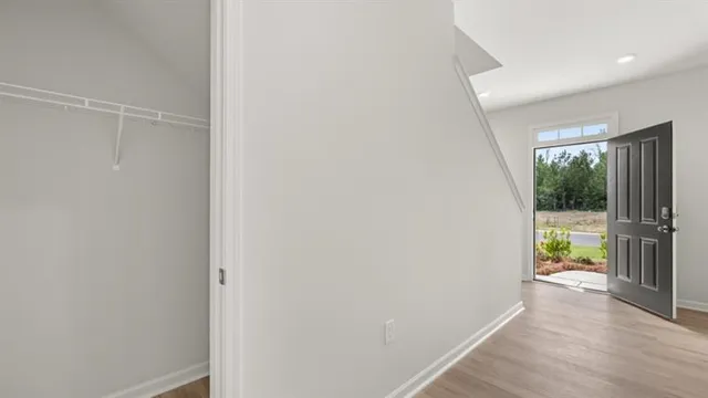 a view of an empty room and a window