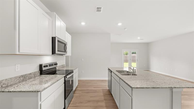 9 Babcock Drive Northeast Rome, GA 30165 - Photo 9 of 52 a kitchen with stainless steel appliances granite countertop a sink stove and cabinets