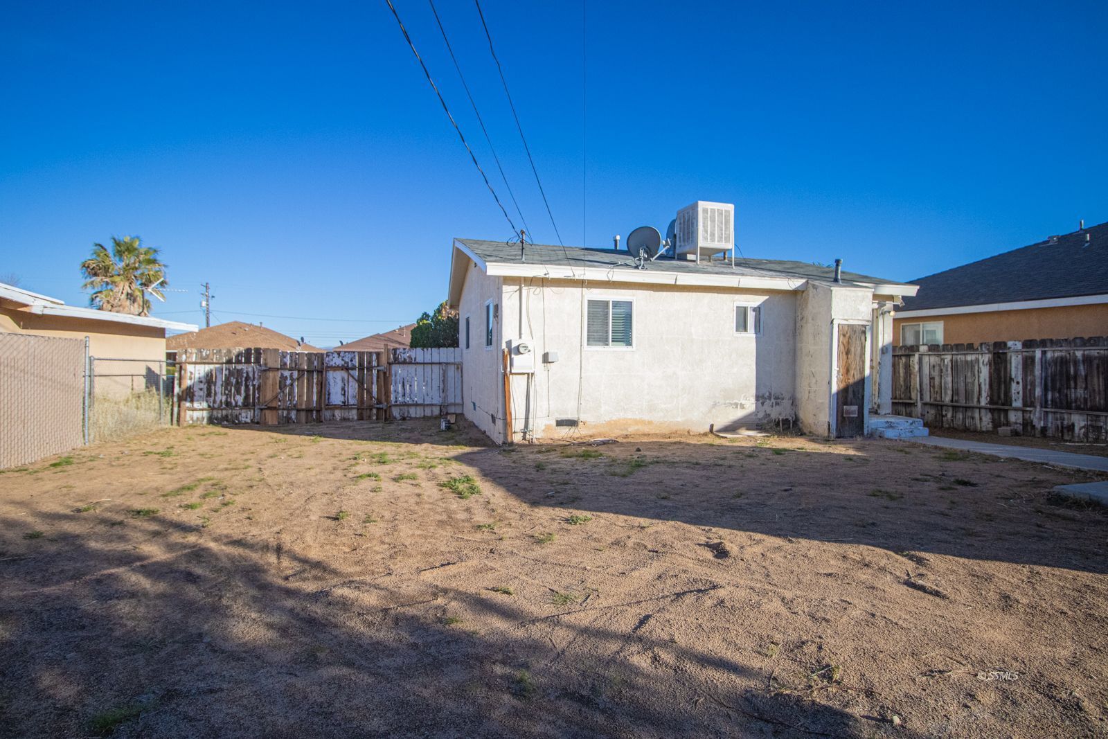 1621 Sims Street Ridgecrest, CA 93555 - Photo 22 of 24 a view of a house with a yard