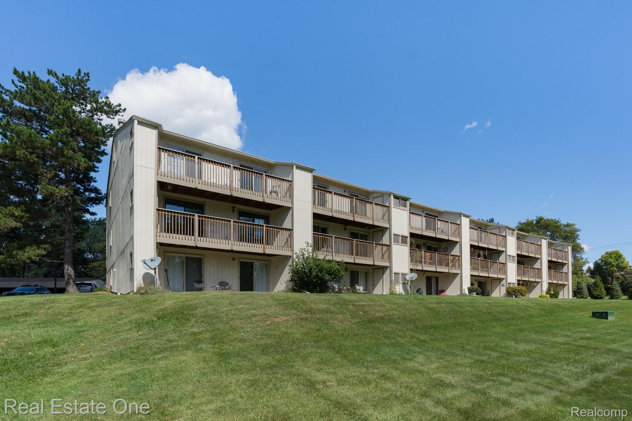1677 Riverside Drive, Unit 16 Rochester, MI 48309 - Photo 24 of 31 REAR VIEW OF THE UNIT - END MID UNIT ON THE LEFT - 1677 Riverside MLS-W038.jpg
