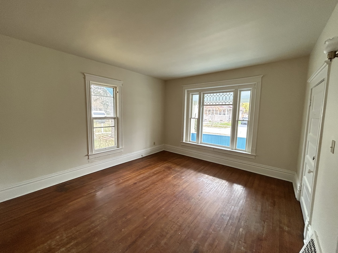 376 Jefferson Avenue Elgin, IL 60120 - Photo 11 of 21 a view of an empty room with wooden floor and window