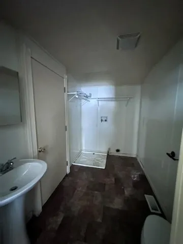 a bathroom with a sink and a toilet